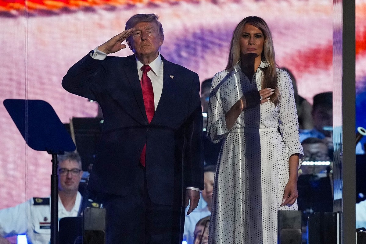 President Donald Trump and first lady Melania Trump stand on stage during "Salute to America 250" Fourth of July celebrations on the National Mall on July 04, 2026 in Washington, DC. Americans are celebrating the nation’s 250th anniversary amidst an extreme heat wave bringing dangerous triple digit temperatures to much of the eastern United States.