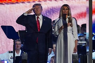 President Donald Trump and first lady Melania Trump stand on stage during "Salute to America 250" Fourth of July celebrations on the National Mall on July 04, 2026 in Washington, DC. Americans are celebrating the nation’s 250th anniversary amidst an extreme heat wave bringing dangerous triple digit temperatures to much of the eastern United States.