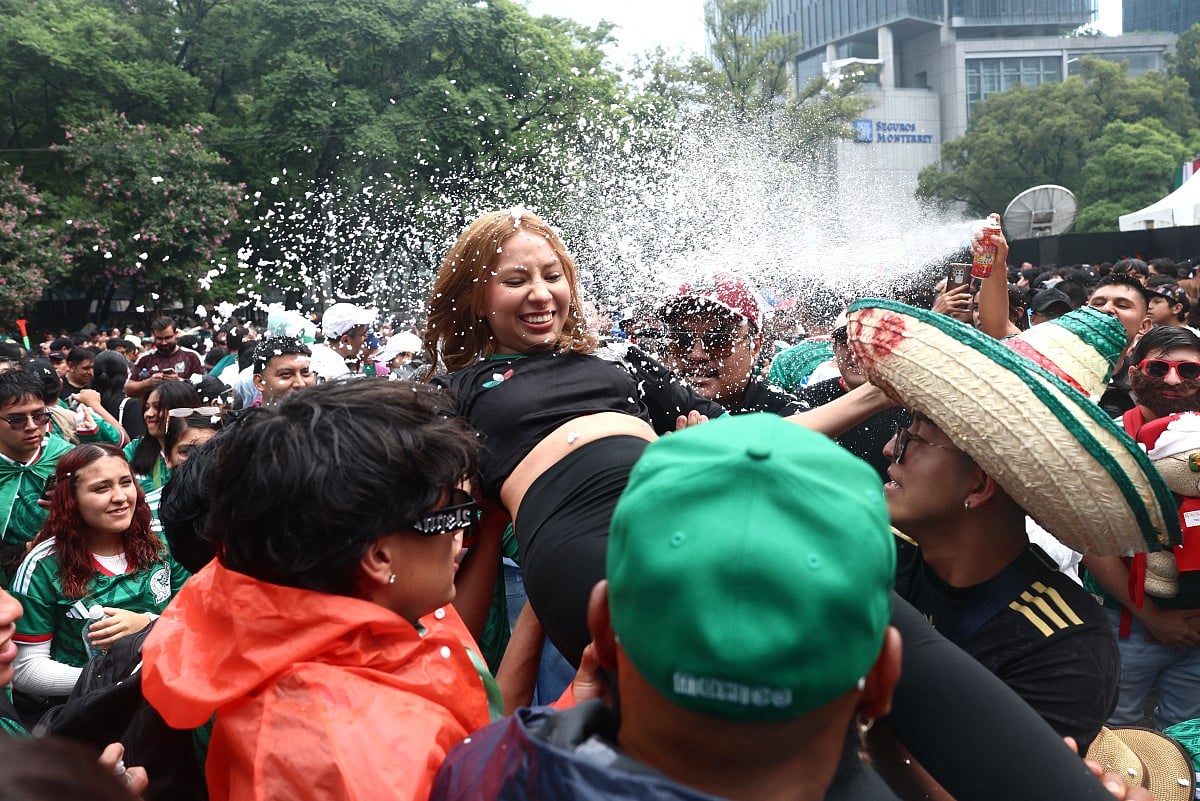 Mexican football fans spray foam as they gather at the Angel of Independence to watch the 2026 FIFA World Cup Round of 16 football match between Mexico and England in Mexico City on July 5, 2026.