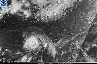 This satellite image from the National Oceanic and Atmospheric Administration shows Typhoon Bavi nearing the U.S. Pacific island territory of Guam on Sunday, July 5, 2026.