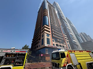 Firefighters evacuate residents, control medium-scale blaze on busy highway