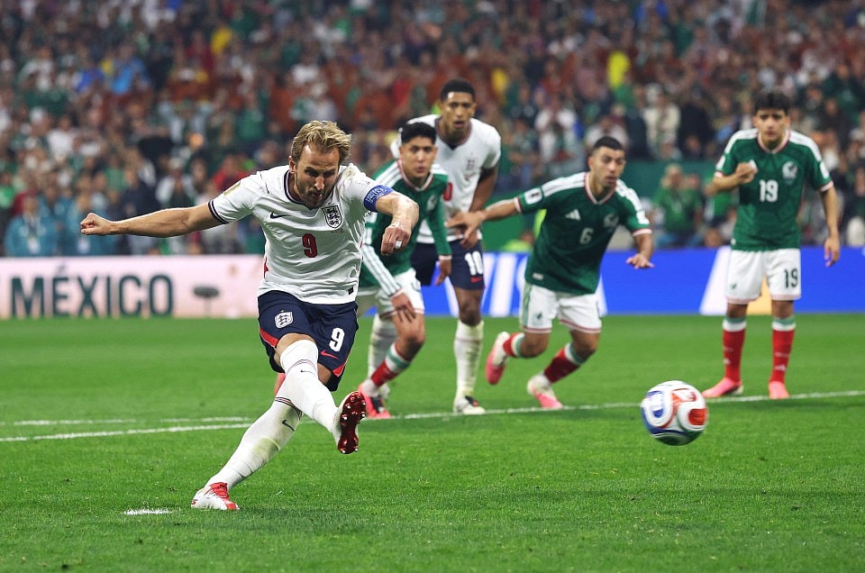 England's Harry Kane converts a second-half penalty to restore his side's two-goal cushion during a dramatic 3-2 victory over Mexico in the FIFA World Cup Round of 16 at Estadio Azteca. Jude Bellingham scored twice before halftime, while England played more than half the second half with 10 men after Jarell Quansah was sent off. Mexico fought back through Julián Quiñones and a late Raúl Jiménez penalty, but the Three Lions held on to seal a quarter-final clash with Norway. After the final whistle, veteran midfielder Jordan Henderson required emergency medical attention and was taken off the pitch on a stretcher following the celebrations.