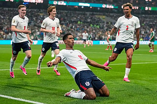 England Jude Bellingham celebrates with team mates. Bellingham scored twice and Harry Kane netted from the penalty spot as England held on grimly to secure a famous victory that sets up a quarter-final against Norway.