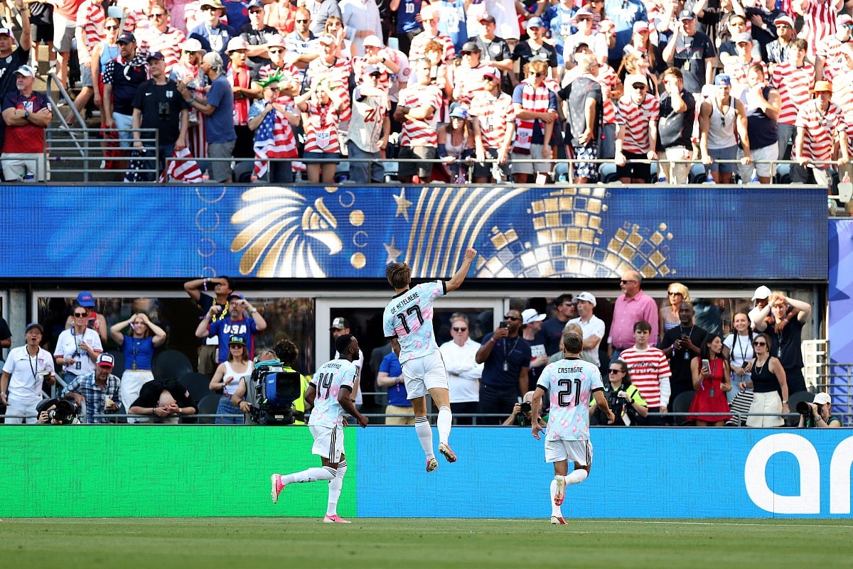 Charles De Ketelaere #17 of Belgium celebrates with teammate Dodi Lukebakio #14 and Timothy Castagne #21 after scoring his team's second goal during the FIFA World Cup 2026 Round of 16 match between USA and Belgium at Seattle Stadium on July 06, 2026 in Seattle, Washington.
