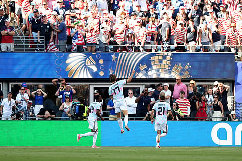 Charles De Ketelaere #17 of Belgium celebrates with teammate Dodi Lukebakio #14 and Timothy Castagne #21 after scoring his team's second goal during the FIFA World Cup 2026 Round of 16 match between USA and Belgium at Seattle Stadium on July 06, 2026 in Seattle, Washington.