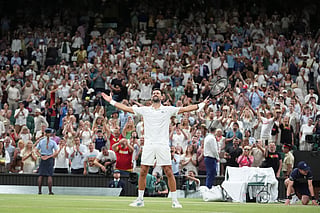 Novak Djokovic of Serbia celebrates winning against Felix Auger-Aliassime of Canada in their quarter-final men's singles match at the Wimbledon Tennis Championships in London, Tuesday, July 7, 2026. (AP Photo/Maja Smiejkowska)