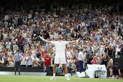 Novak Djokovic of Serbia celebrates winning against Felix Auger-Aliassime of Canada in their quarter-final men's singles match at the Wimbledon Tennis Championships in London, Tuesday, July 7, 2026. (AP Photo/Maja Smiejkowska)