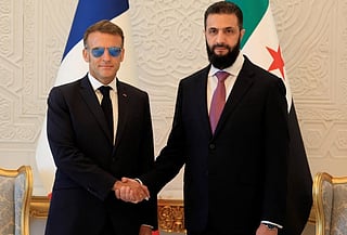 Syria's President Ahmed Al Sharaa (right) with France's President Emmanuel Macron ahead of their meeting at the People's Palace in Damascus on July 7, 2026. 