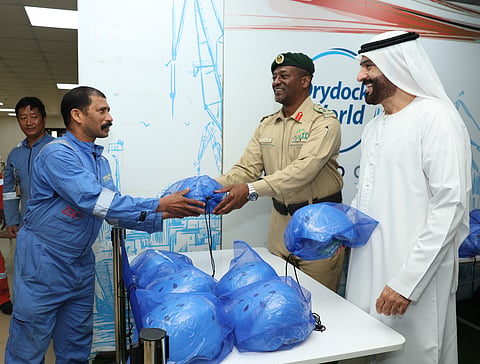 Dubai Police promotes cycling safety among Drydocks World workers.