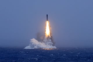 In this photo released by Xinhua News Agency, a long-range ballistic missile bursts out of the sea during a test launched from a Chinese nuclear-powered submarine in the South Pacific on Monday, July 6, 2026.