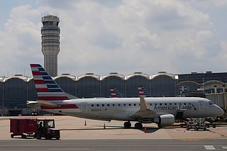FILE - An American Eagle plane is parked at a gate at the Ronald Reagan Washington National Airport in Arlington, Va., June 29, 2026. (AP Photo/Carolyn Kaster, File)
