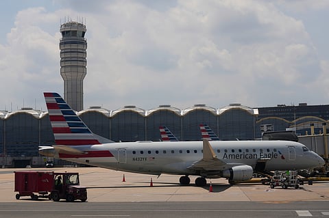 FILE - An American Eagle plane is parked at a gate at the Ronald Reagan Washington National Airport in Arlington, Va., June 29, 2026. (AP Photo/Carolyn Kaster, File)