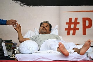 Climate activist Sonam Wangchuk takes a glass of water during his hunger strike in New Delhi on July 7, 2026.