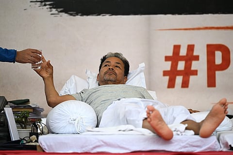Climate activist Sonam Wangchuk takes a glass of water during his hunger strike in New Delhi on July 7, 2026.