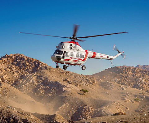 RAK Police Air Wing crews during an aerial mission supporting public safety.