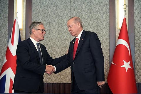 Britain's Prime Minister Keir Starmer (L) and Turkey's President Recep Tayyip Erdogan sign a defense partnership agreement on the sidelines of the NATO Summit at Bestepe Presidential Compound in Ankara, on July 8, 2026.