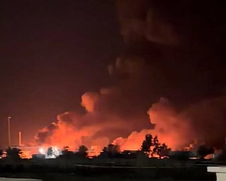 Smoke rises from a port near Strait of Hormuz, following a US strike in Kuhestak, Hormozgan Province, Iran, July 8, in this screengrab obtained from a social media video. 