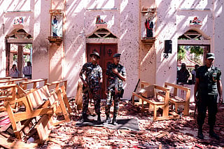 Sri Lankan soldiers inspect the St Sebastian's Church at Katuwapitiya in Negombo on April 21, 2019, following a bomb blast during an Easter service.