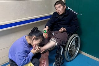 A Henan woman woke her husband from a seven-year vegetative state — caused by a heroic rescue — by biting his toes.