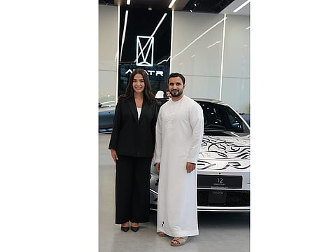 Fayha Al Malla, Vice President of Operations at SMI, with calligraphy artist Diaa Allam at the opening of the showroom