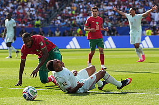 France's Kylian Mbappe (10) reacts to being tripped by Morocco's Issa Diop, left, during the World Cup quarterfinal soccer match between France and Morocco in Foxborough, Mass., near Boston, Thursday, July 9, 2026. (AP Photo/Stephanie Scarbrough)