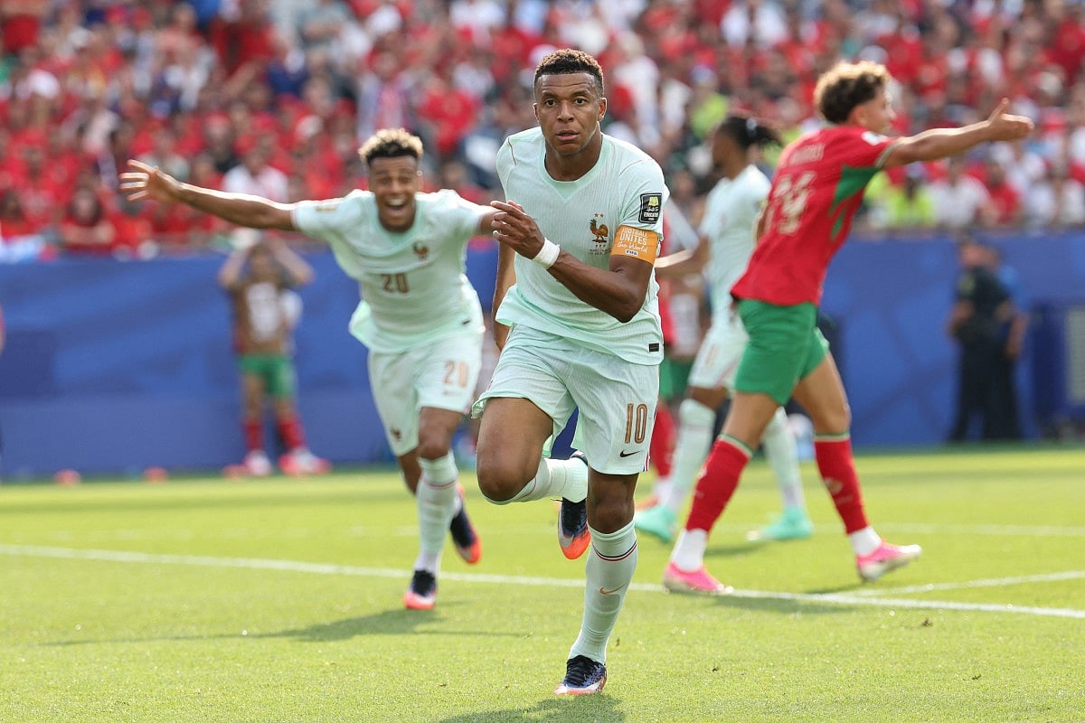 France's forward #10 Kylian Mbappe celebrates scoring his team's first goal during the 2026 World Cup football tournament quarter-final match between France and Morocco at Boston Stadium in Foxborough on July 9, 2026.