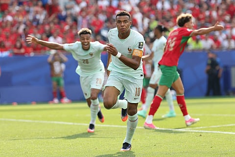France's forward #10 Kylian Mbappe celebrates scoring his team's first goal during the 2026 World Cup football tournament quarter-final match between France and Morocco at Boston Stadium in Foxborough on July 9, 2026.
