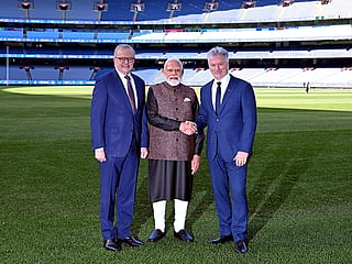 Australia’s Prime Minister Anthony Albanese (L) stands next to Indian Prime Minister Narendra Modi (C) as he shakes hands with former Australian cricket team captain Steve Waugh (R) during a visit to the Melbourne Cricket Ground (MCG) on July 10, 2026. 