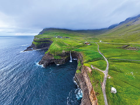 Aerial view of Gasadalur Village and Mulafossur Waterfall, Faroe Islands