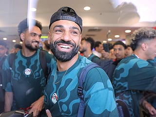 Mohamed Salah, smiles as he is greeted by fans upon the Egyptian national soccer team arrival at El Alamein airport, 160 km (99 miles) west of Alexandria, Egypt, on Friday, July 10, 2026. 