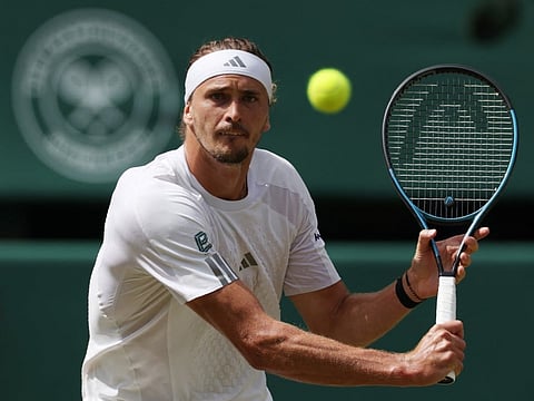 Germany's Alexander Zverev returns to Britain's Arthur Fery during their men's singles semi-final of the 2026 Wimbledon Championships at The All England Lawn Tennis and Croquet Club in Wimbledon, southwest London, on July 10, 2026.