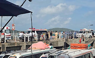 Ambulances line up on a pier to help victims of a boating accident after a tourist vessel capsized off Phu Quoc Island in southern Vietnam's An Giang Province on July 11, 2026.