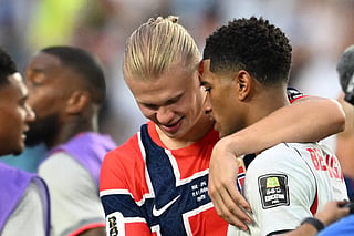 Norway's forward #09 Erling Braut Haaland (L) congratulates England's midfielder #10 Jude Bellingham at the end of the 2026 World Cup football tournament quarter-final match between Norway and England at Miami Stadium in Miami on July 11, 2026.