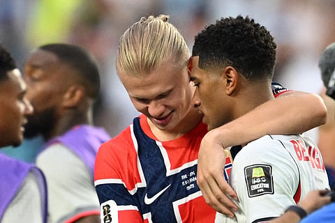 Norway's forward #09 Erling Braut Haaland (L) congratulates England's midfielder #10 Jude Bellingham at the end of the 2026 World Cup football tournament quarter-final match between Norway and England at Miami Stadium in Miami on July 11, 2026.
