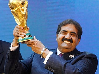 Sheikh Hamad bin Khalifa Al Thani holds the FIFA World Cup trophy after Qatar was awarded the 2022 World Cup in Zurich on December 2, 2010. The tournament became one of the defining milestones of his reign. 