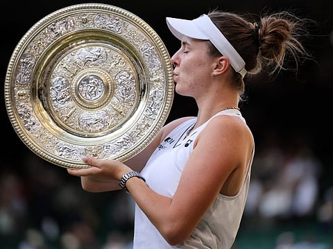 Czech Republic's Linda Noskova kisses the winner's trophy, the Venus Rosewater Dish, after beating Czech Republic's Karolina Muchova during their women's singles final of the 2026 Wimbledon Championships at The All England Lawn Tennis and Croquet Club in Wimbledon, southwest London, on July 11, 2026.