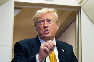 President Donald Trump speaks with reporters in flight on Air Force One after landing at U.S. Air Force Base at RAF Mildenhall, in Suffolk, Eastern England, Wednesday, July 8, 2026.