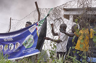 Workers at an Ebola treatment center go on strike over unpaid salaries and bonuses at Rwampara General Hospital, in Ituri, northeastern Congo, Monday, July 13, 2026, (AP Photo/Dirole Lotsima Dieudonne)