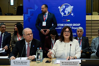 European Commissioner for the Mediterranean Dubravka Suica, right, and Palestinian Prime Minister Mohammad Mustafa participate in a round table meeting of the Palestinian Donor Group at EU headquarters in Brussels, Monday, July 13, 2026. (John Thys, Pool Photo via AP)