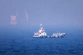 This picture shows ships sailing near the Strait of Hormuz off the eastern coast of the United Arab Emirates at Khor Fakkan on July 13, 2026.