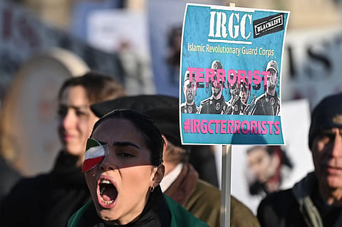 Protesters hold placards at a march in central London against the Islamic revolutionary Guard Corps (IRGC).