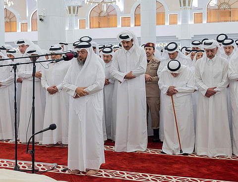 Qatar's Emir Sheikh Tamim bin Hamad Al Thani (C) attending the funeral of his father, former leader Sheikh Hamad bin Khalifa Al Thani, at the Imam Mohammed ibn Abd Al Wahhab Mosque in Doha.
