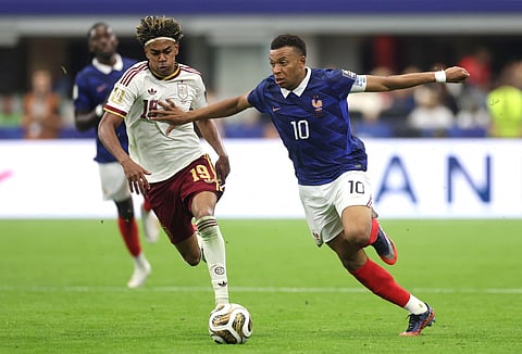 Kylian Mbappe #10 of France competes for the ball against Lamine Yamal #19 of Spain during the FIFA World Cup 2026 Semi Final match between France and Spain at Dallas Stadium on July 14, 2026 in Arlington, Texas.