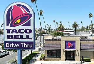 In an aerial view, a person enters a Taco Bell restaurant on July 14, 2026 in Pasadena, California.
