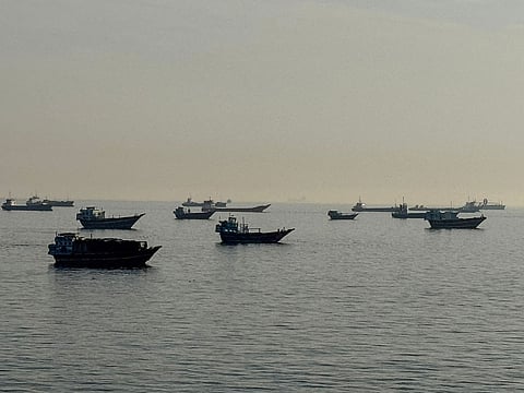 Vessels are seen anchored in the Strait of Hormuz, off the port city of Khasab on Oman’s northern Musandam Peninsula on May 17, 2026. 