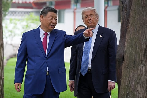 FILE - President Donald Trump talks with China's President Xi Jinping at the Zhongnanhai leadership compound, May 15, 2026, in Beijing. 