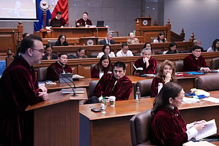 Philippine Senator Robin Padilla (C) listens during the impeachment trial for Philippine Vice President Sara Duterte at the Philippine Senate in Pasay city on July 15, 2026.