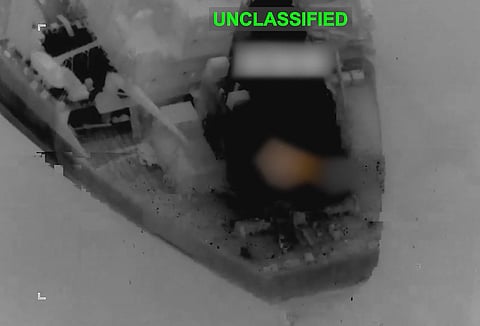A screengrab from a forward-looking infrared (FLIR) camera footage shared by the US military, moments before an aircraft fired AGM-114 Hellfire missiles into the smokestack of a vessel trying to run the US blockade on Iran, disabling the vessel without sinking it.