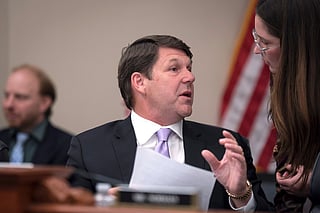 House Budget Committee Chairman Jodey Arrington, R-Texas, center, speaks with an aide during a markup on the Fiscal Year 2027 spending plan, at the Capitol in Washington, Thursday, July 16, 2026. (AP Photo/J. Scott Applewhite)