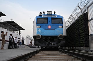 A security personnel and media persons capture visuals of the Indian Railways' hydrogen-powered train at a depot ahead of its launch in Haryana's Jind on July 16, 2026.